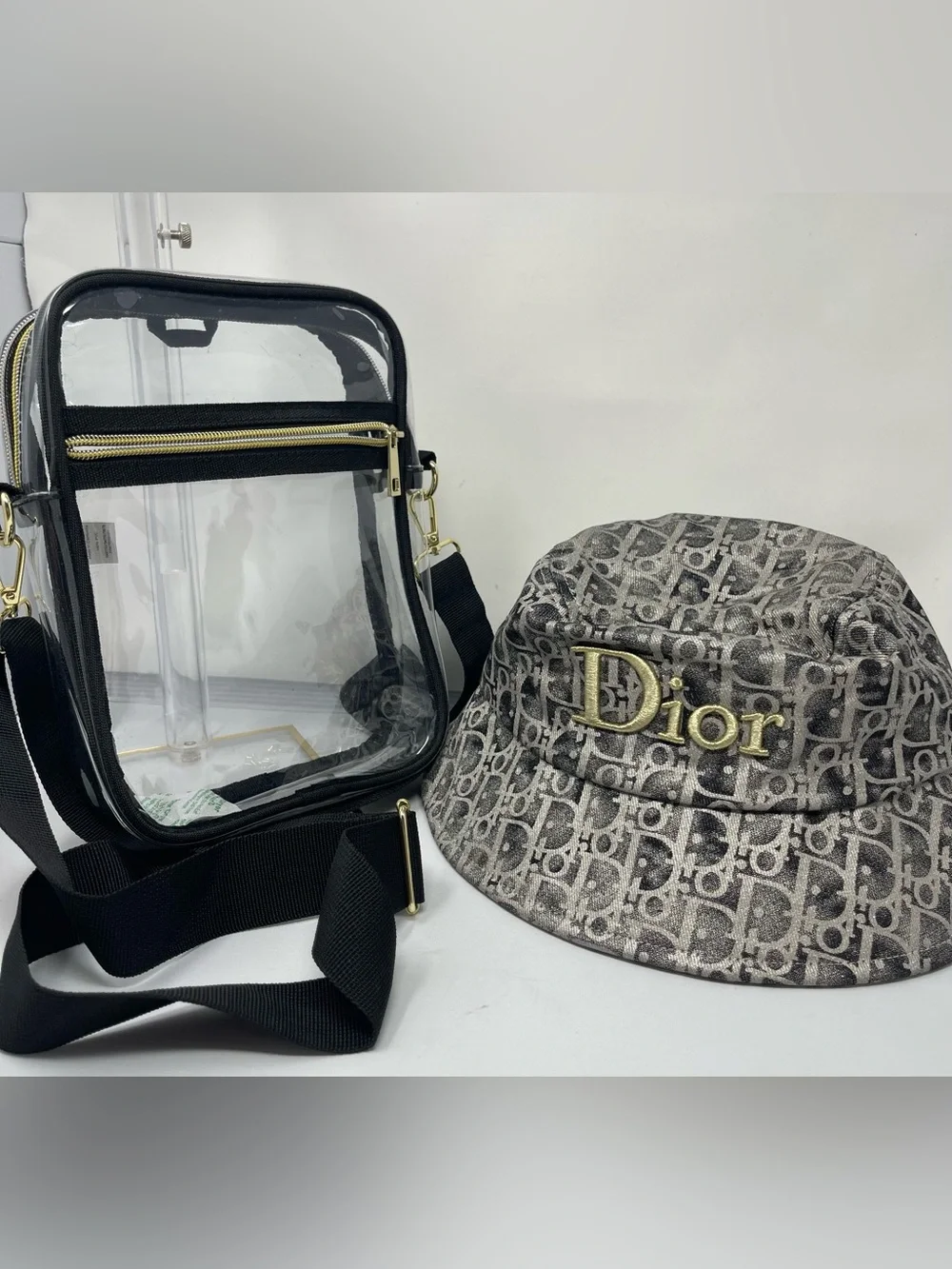 Fashion monogram bucket hat with gold and metallic gray accents & Clear bag